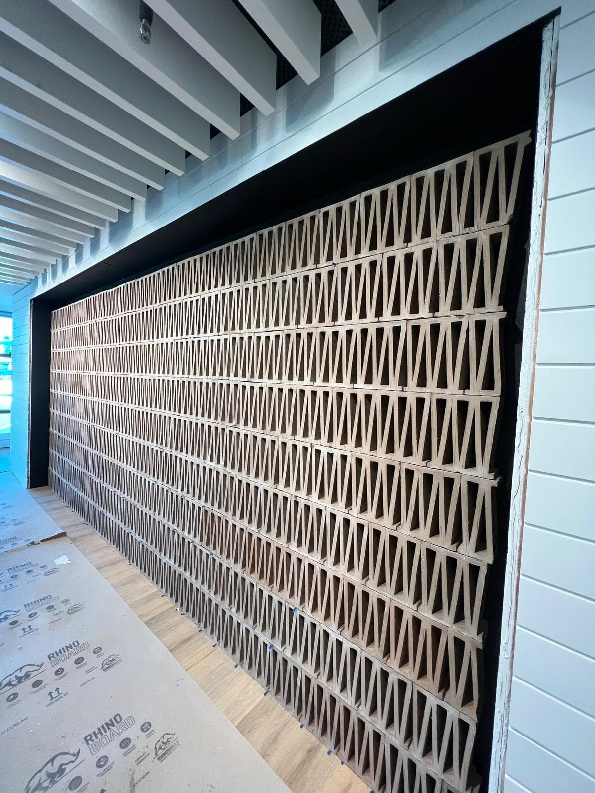 Large commercial building lobby with tiled floor